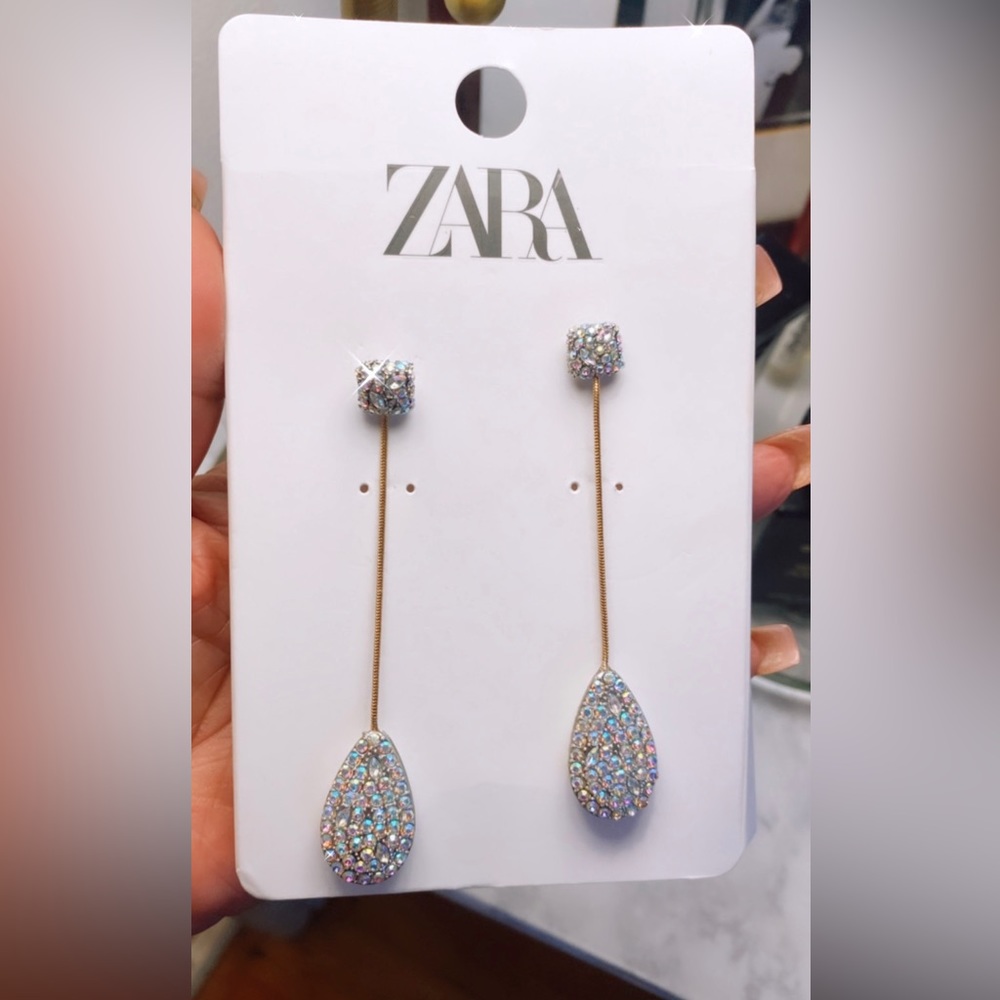 Jeweled drop pierced earrings.